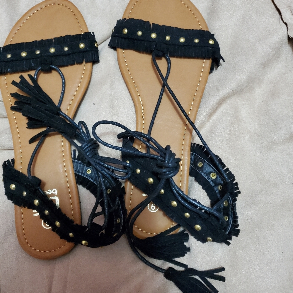 Sandals with tie up laces with tassels